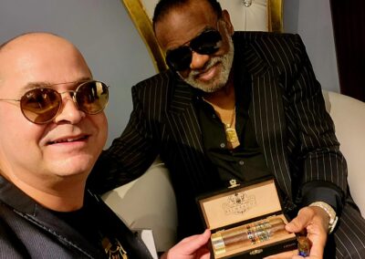 Sam Falaki presenting a Belmaachi cigar gift box to Ron Isley during the Art of Whiskey event in New Orleans.